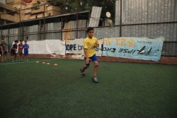 Young Palestinian boy playing football