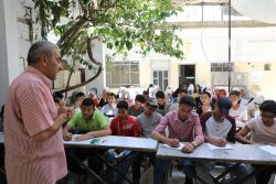 Teacher teaches class of young people